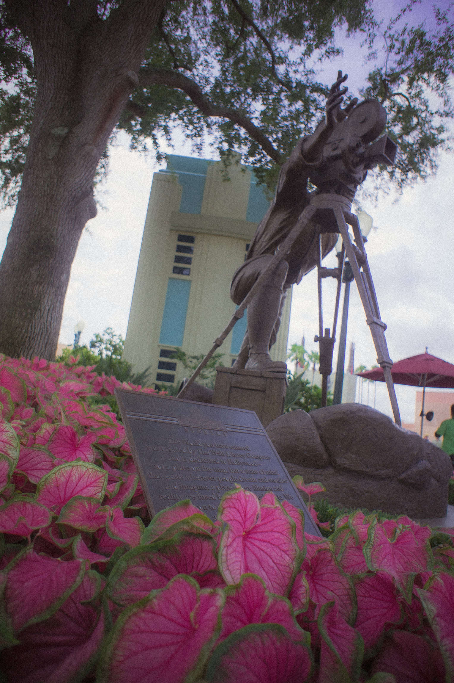 Statue and pink foliage edited with Janky 400